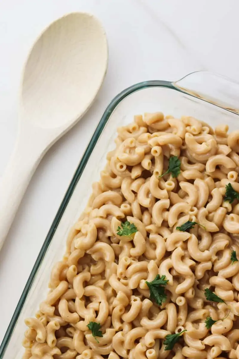 dish of low fat mac and cheese with a wooden spoon