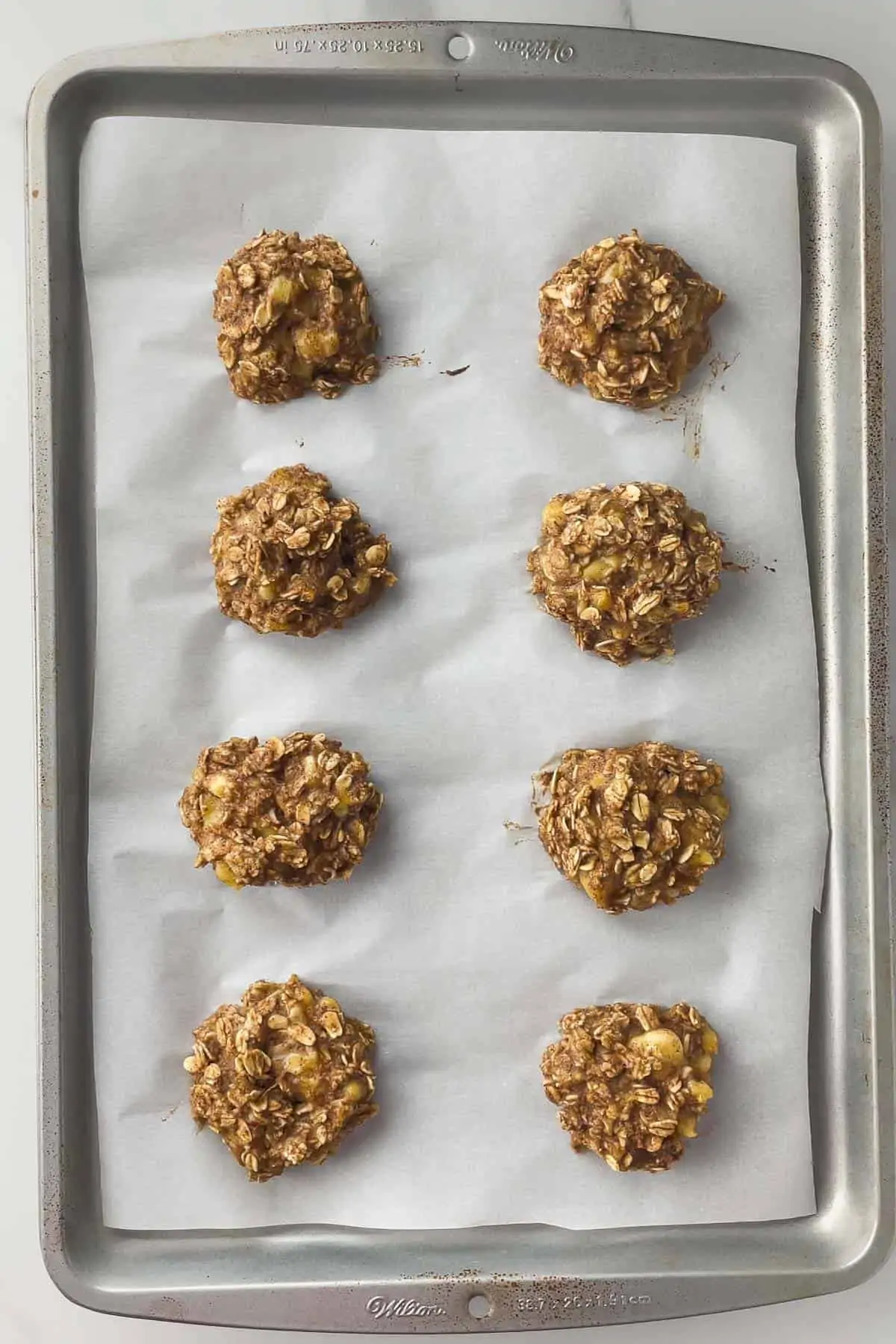 banana oatmeal cookies on a baking sheet