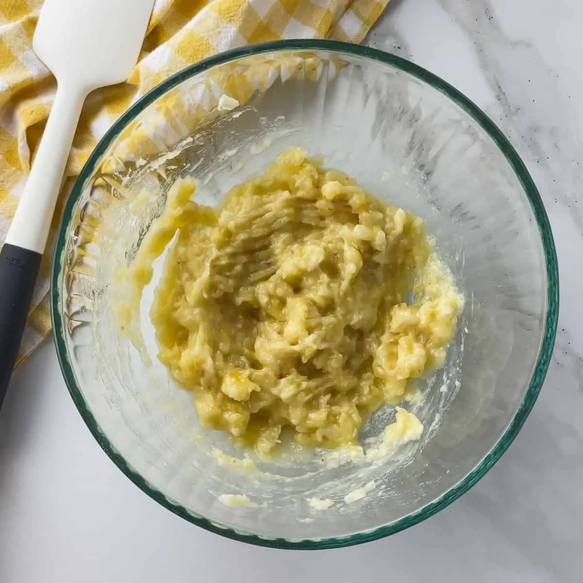 banana mashed in a mixing bowl