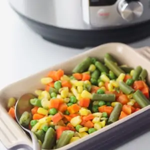 dish of mixed vegetables in front of the instant pot